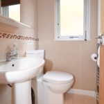 Separate bathroom with sink and toilet