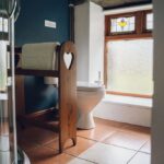 Bathroom with toilet and shower in Ty Hebog