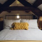 Double bed in the Crog loft bedroom at Ty Hebog self catering holiday cottage
