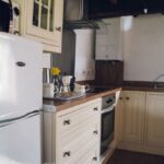 Fully equipped kitchen with fridge freezer, hob and electric oven