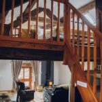 View of Ty Hebog cottage interior with the Crog loft above and open plan kitchen, sitting and dining area below