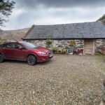 Outside parking area next to Ty Hebog cottage at Perthi Holiday Cottages in Beddgelert