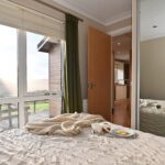 Double bedroom with wardrobe and mountain views