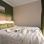 Double bedroom with large wardrobe and mountain views