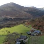Perthi Holiday Cottages aerial view with Moel Hebog in the distance